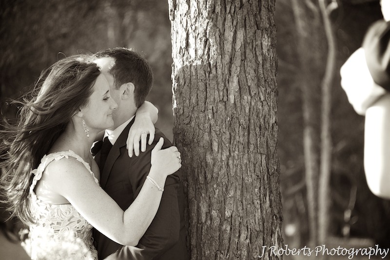 Sepia of couple embracing = wedding photography sydney